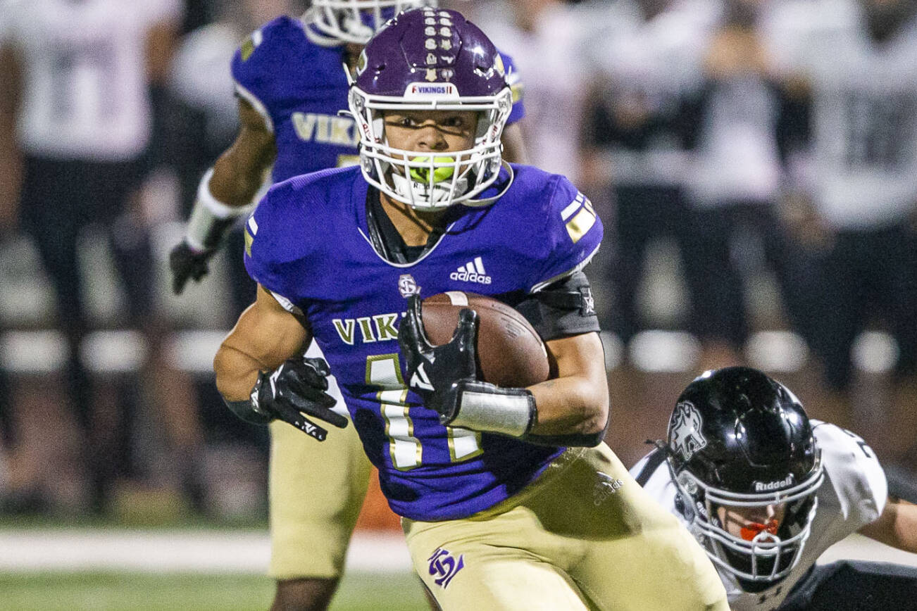 Lake Stevens’ Jayden Limar runs the ball during the game against Eastlake on Friday, Oct. 7, 2022 in Lake Stevens, Washington. (Olivia Vanni / The Herald)