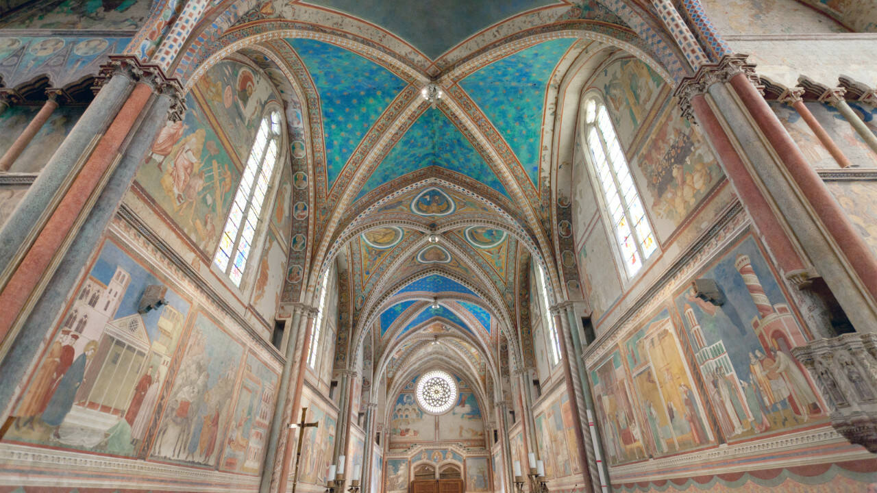 Assisi’s Basilica of St. Francis — colorfully frescoed by Giotto — inspires tourists and pilgrims today.