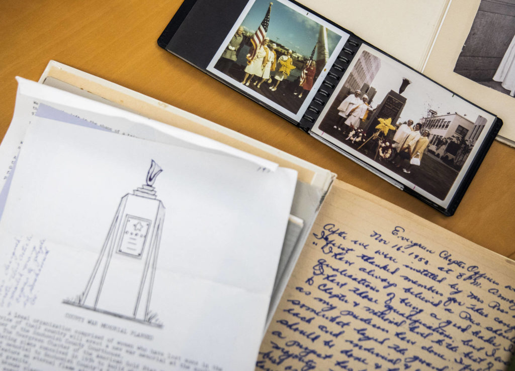Photographs and documents of the original Eternal Flame monument on the Snohomish County Campus on Nov. 3, in Everett. (Olivia Vanni / The Herald)
