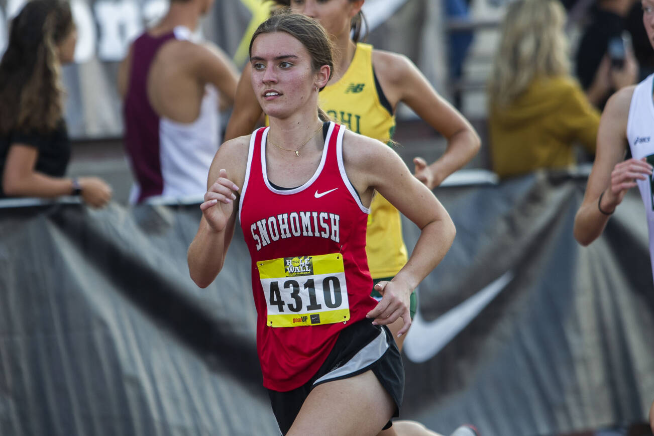 Snohomish’s Paige Gerrard runs their first lap in the girls elite race at the Hole In The Wall Invitational on Saturday, Oct. 8, 2022 in Arlington, Washington. (Olivia Vanni / The Herald)