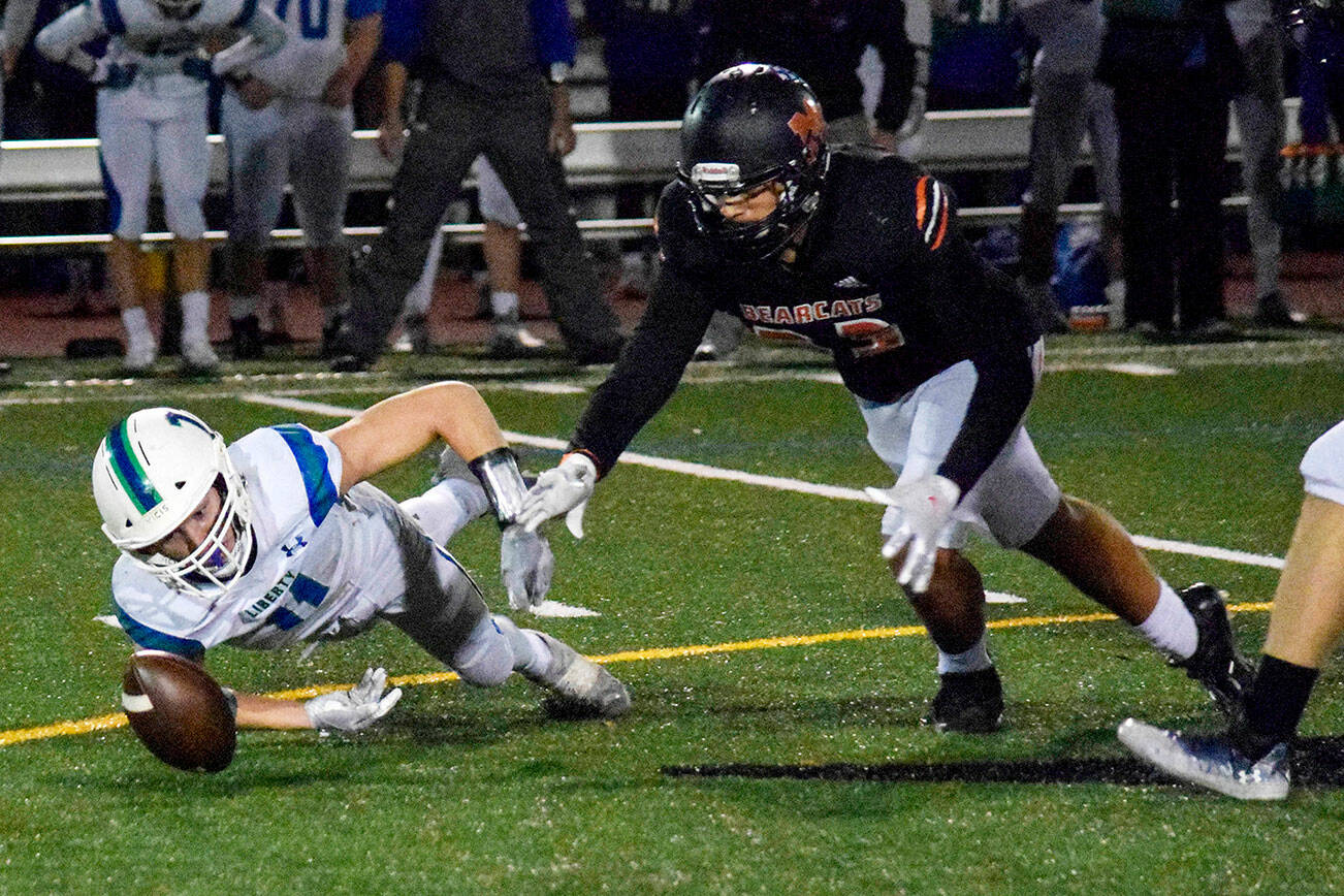 Monroe junior Jack Irwin dives to recover a Liberty fumble on Friday, Nov. 4, 2022 during a game at Monroe High in Monroe, Washington. Monroe forced five turnovers in the game, advancing to the Class 3A round of 16. (Katie Webber / The Herald)