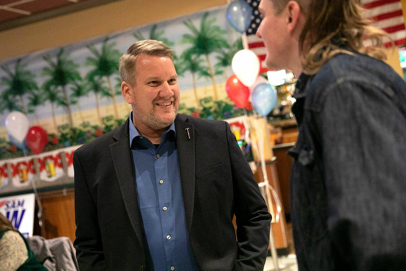 Sam Low greets a supporter as people begin to stream in during a midterm election night watch party on Tuesday, Nov. 8, 2022, at Papa’s Mexican Grill in Lake Stevens, Washington. (Ryan Berry / The Herald)