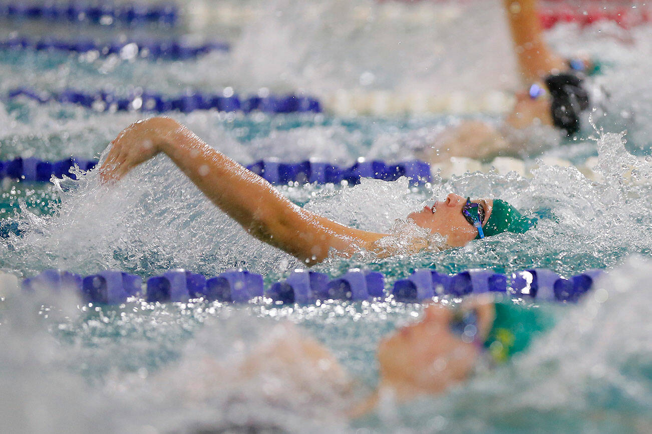 Shorecrest’s Miranda Thompson swims neck and neck with her opponents in the 100 yard backstroke during the Class 4A District swim meet Saturday, Nov. 5, 2022, at Snohomish Aquatic Center in Snohomish, Washington. (Ryan Berry / The Herald)