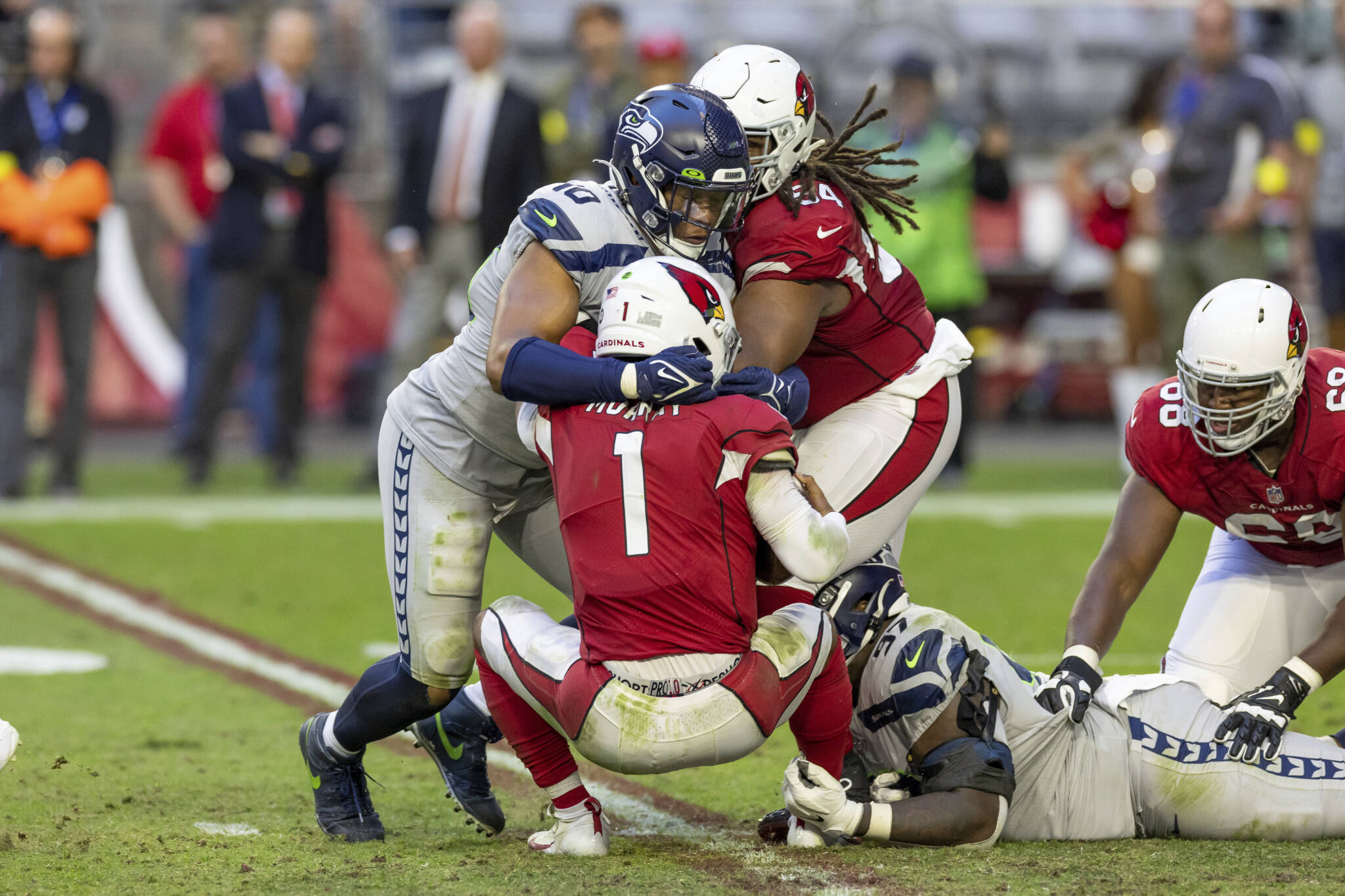 Seahawks linebacker Uchenna Nwosu (10) sacks Cardinals quarterback Kyler Murray (1) during a game on Sunday in Glendale, Ariz. (AP Photo/Jeff Lewis)