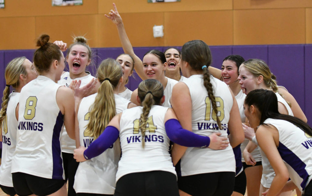 Lake Stevens&rsquo; volleyball team members celebrate their win over Bothell after a 4A District 1/2 Tournament match on Nov. 8, 2022, in Lake Stevens. (John Gardner / Pro Action Image)

