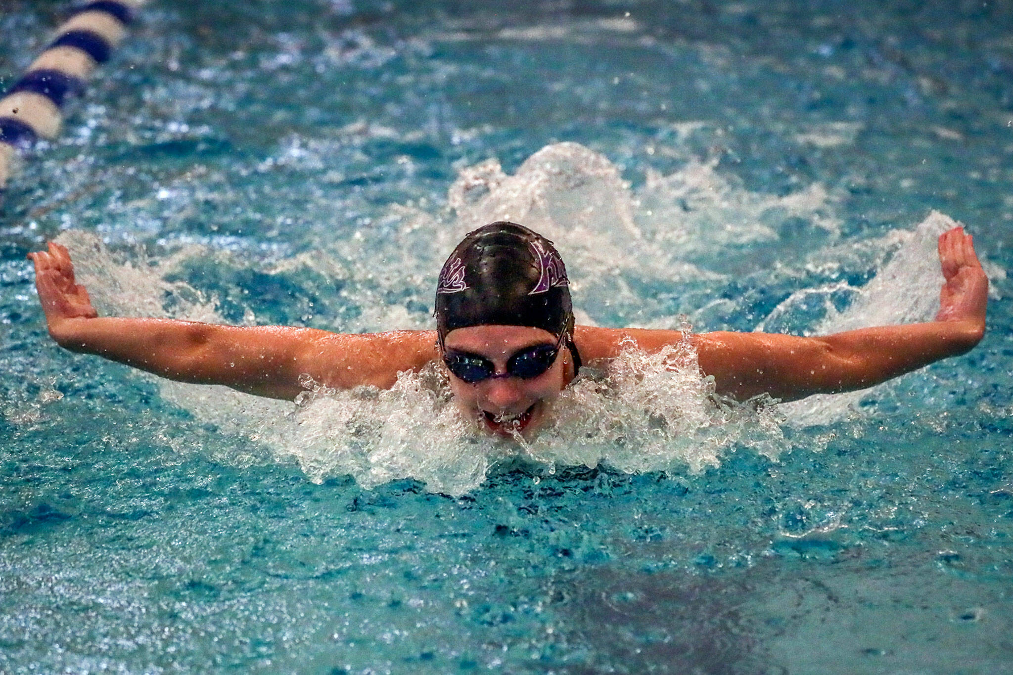 Kamiak junior Claire Smith, the defending 4A butterfly state champion, is one of many top local contenders at the state girls swim and dive championships. (Kevin Clark / The Herald)