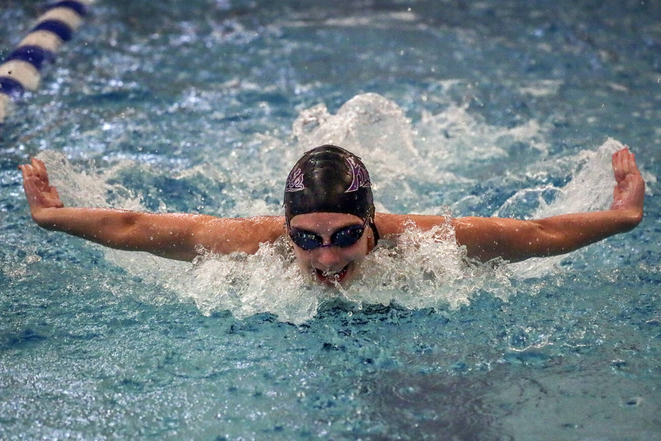 Kamiak’s Claire Smith competes in the 100 yard butterfly Thursday afternoon at Kamiak High School in Mukilteo, Washington on October 6, 2022.  (Kevin Clark / The Herald)