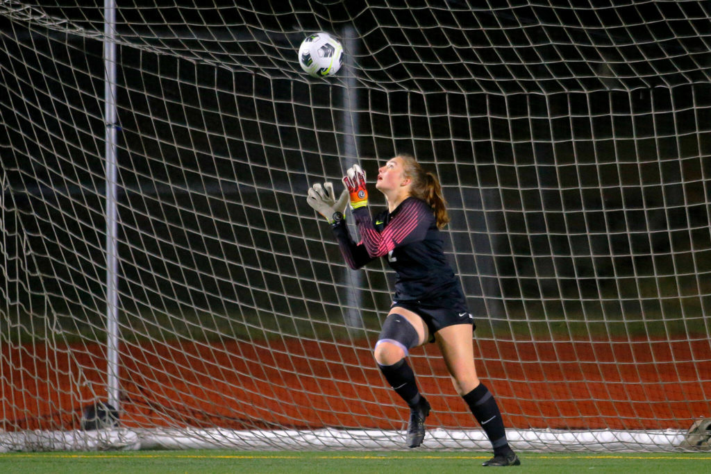 Auburn Mountainview’s Emily Henry catches the ball after blocking a shot up into the air against Mountlake Terrace on Wednesday, Nov. 9, 2022, Edmonds District Stadium in Edmonds, Washington. (Ryan Berry / The Herald)
