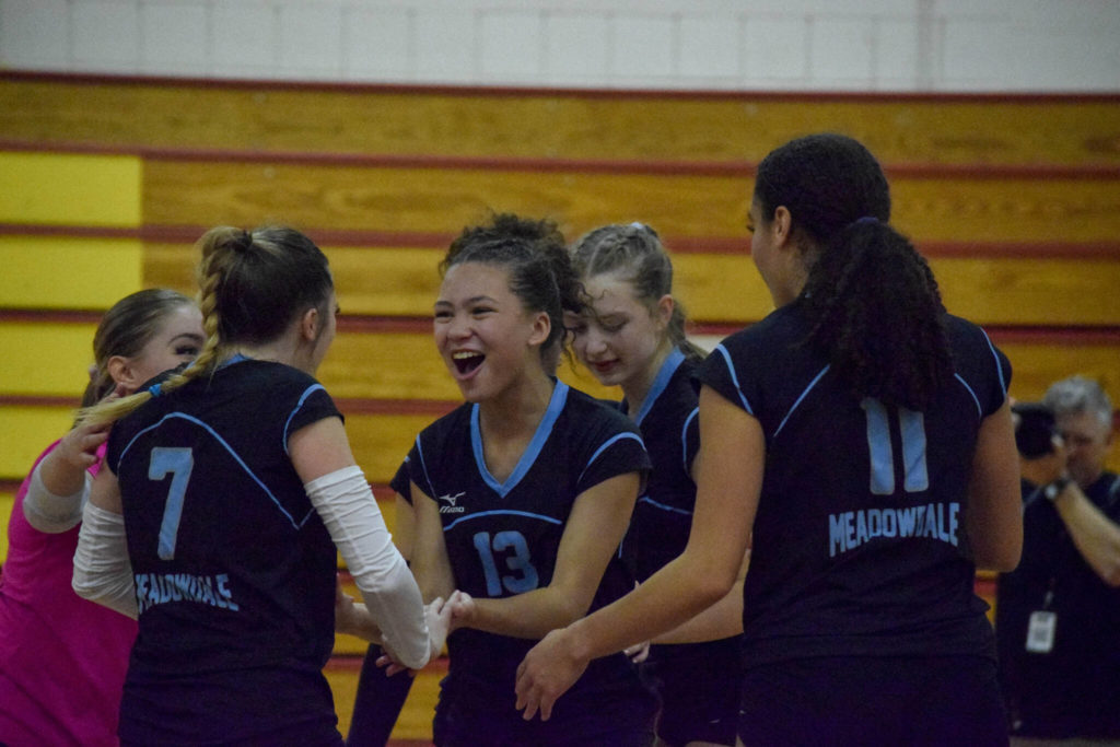 Meadowdale freshman Ja’elle Jenkins (13) smiles with her teammates during a 3A District 1 Tournament semifinal match against Monroe on Thursday, Nov. 10, 2022, at Marysville Pilchuck High School. (Katie Webber / For The Herald)
