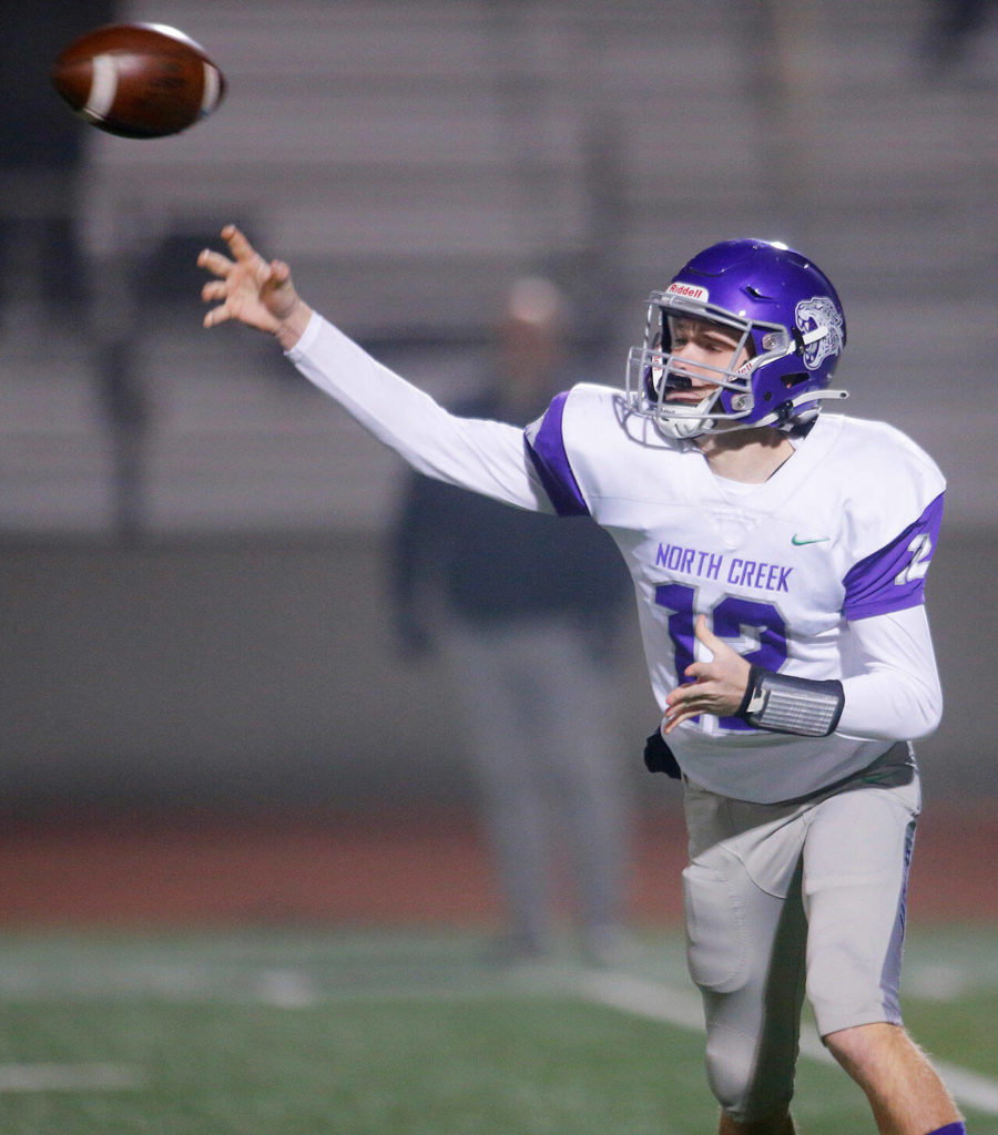 North Creek’s Luc Naldrett attempts a pass during a playoff game against Lake Stevens on Friday, Nov. 11, 2022, at Lake Stevens High School in Lake Stevens, Washington. (Ryan Berry / The Herald)
