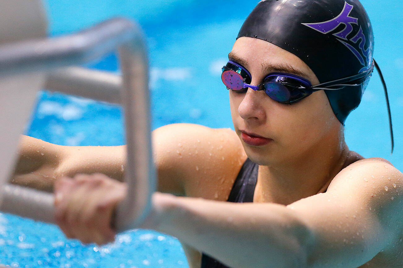 Kamiak’s Claire Smith prepares to start the 100 yard backstroke final during the WIAA 4A Girls State Swim & Dive Championships on Saturday, Nov. 12, 2022, at the Weyerhaeuser King County Aquatic Center in Federal Way, Washington. (Ryan Berry / The Herald)