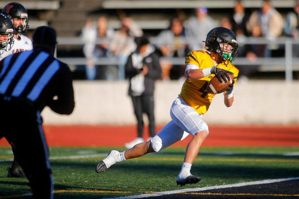 Lincoln’s Jemani Teplasy heads into the end zone on a first quarter touchdown during a playoff matchup against Monroe on Saturday, Nov. 12, 2022, at the Lincoln Bowl in Tacoma, Washington. (Ryan Berry / The Herald)
