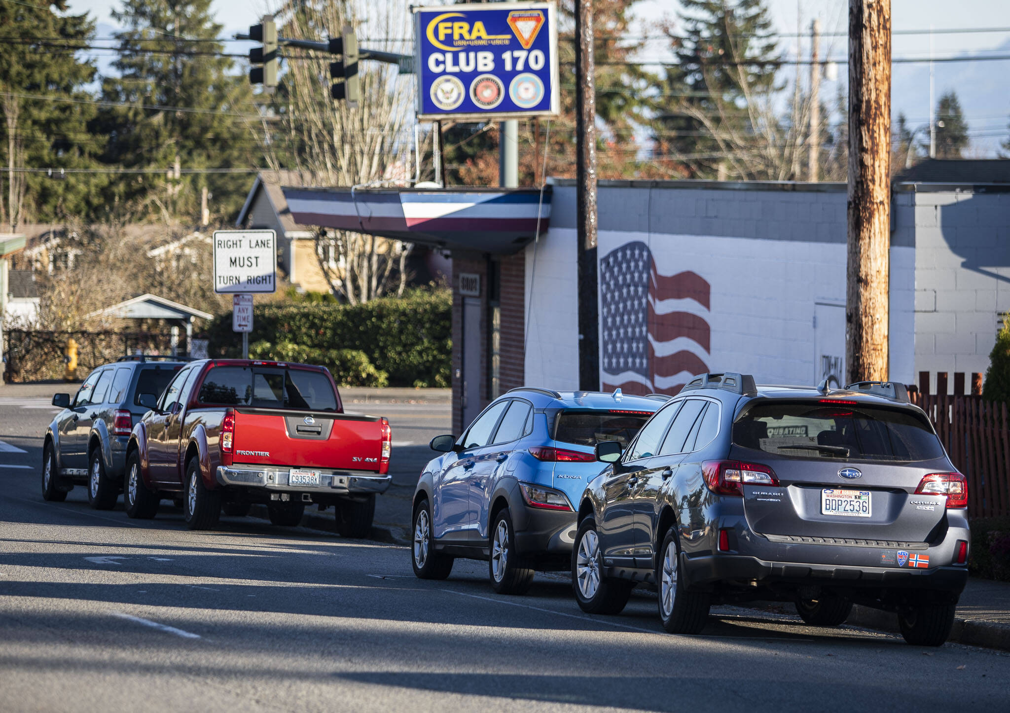 Cars park along Madison Street on Thursday in Everett. (Olivia Vanni / The Herald)