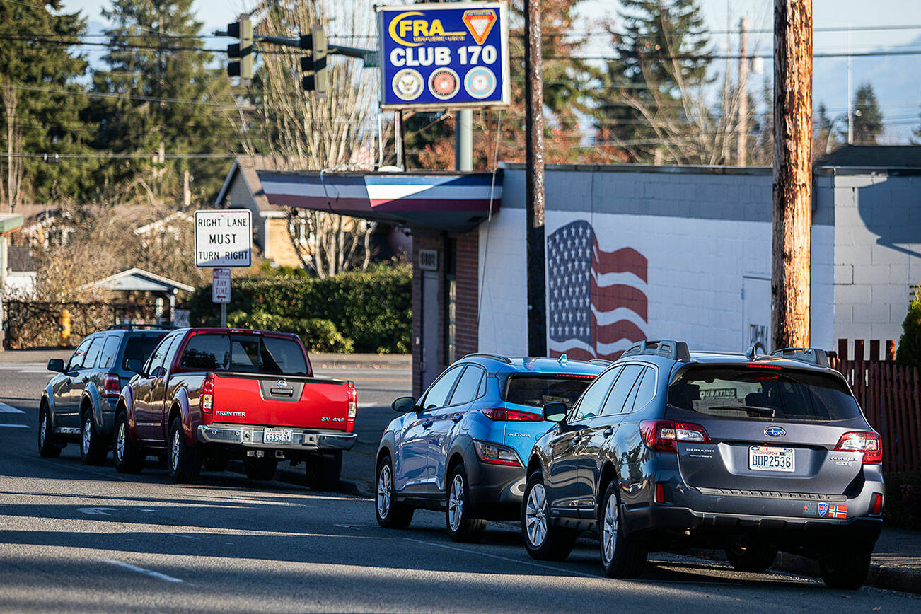 Cars park along Madison Street on Thursday, Nov. 17, 2022 in Everett, Washington. (Olivia Vanni / The Herald)