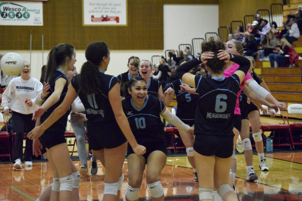 Meadowdale junior Lataya Mitchell (10) celebrates with her team after the Mavericks’ win over Monroe in a Class 3A District 1 tournament semifinal match Nov. 10 at Marysville Pilchuck High School. The Mavericks are seeded ninth in the 3A state bracket. (Katie Webber / For The Herald)
