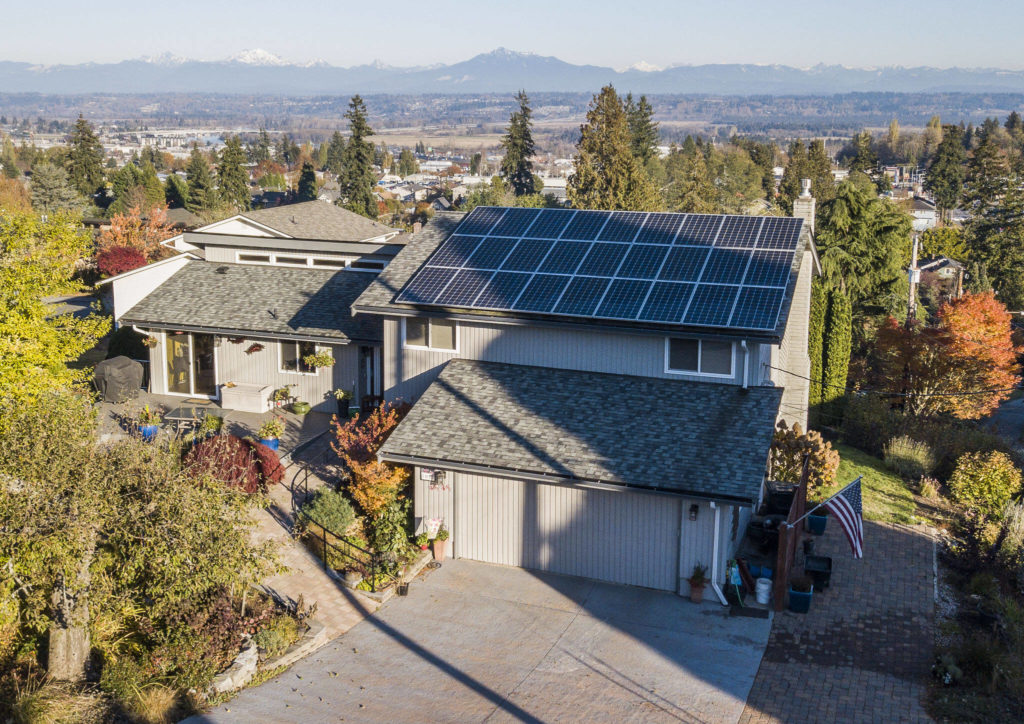 Solar panels are visible along the rooftop of the Crisp family home on Monday, in Everett. (Olivia Vanni / The Herald) 
