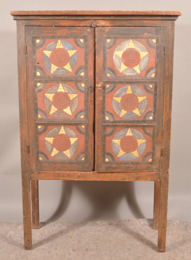 Pie safes like this one were a 19th-century form of food storage. Try saying “punched tin panels protected pies” 10 times fast!