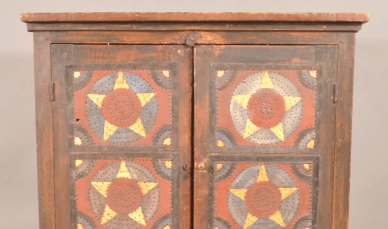 Pie safes like this one were a 19th-century form of food storage. Try saying “punched tin panels protected pies” 10 times fast!