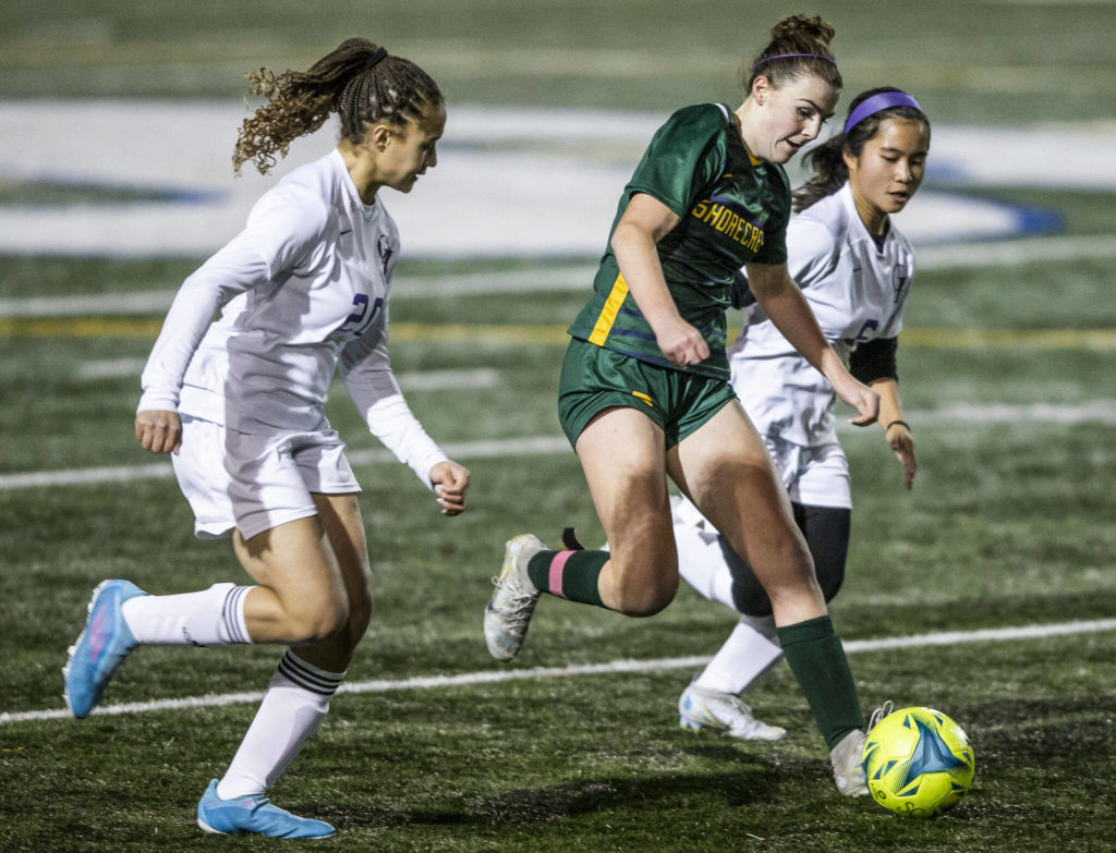 A Shorecrest player dribbles the ball down the field during game against Oak Harbor on Tuesday, Nov. 1, 2022 in Shoreline, Washington. (Olivia Vanni / The Herald)
