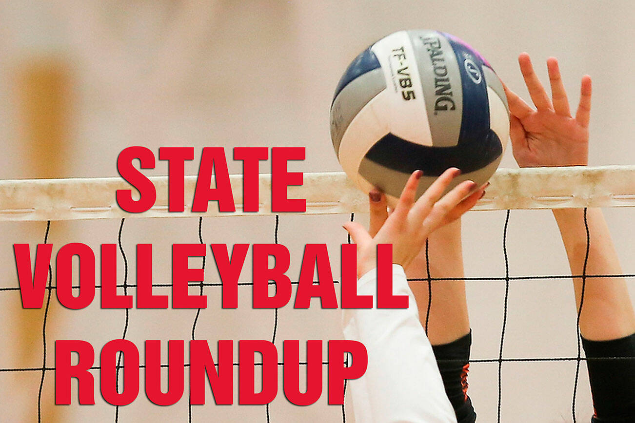 Stanwood's Mischa Kessler is blocked by Monroe's Campbell Barrow as Stanwood took on Monroe in a volleyball game on Wednesday, March 17, 2021 in Stanwood, Washington.  (Andy Bronson / The Herald)