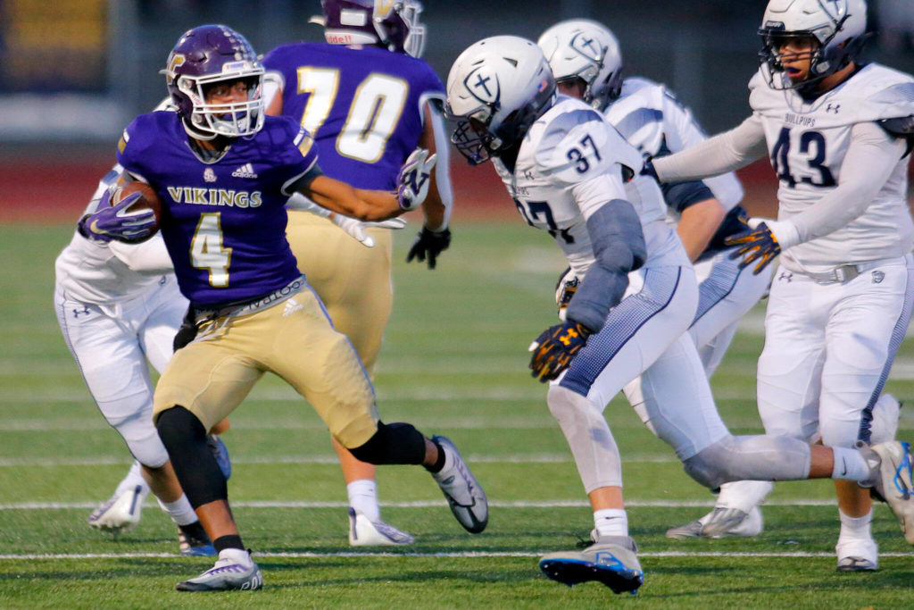 Lake Stevens’ Cassidy Bolong-Banks tries to get past the defense before being run out of bounds against Gonzaga Prep on Saturday, Nov. 19, 2022, at Lake Stevens High School in Lake Stevens, Washington. (Ryan Berry / The Herald)
