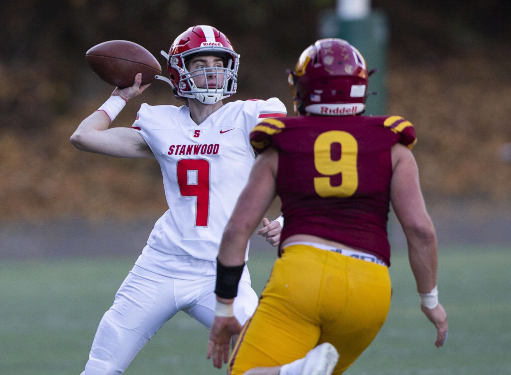 Stanwood’s Luke Brennan throws the ball during the 3A quarterfinal game against Odea on Saturday, Nov. 19, 2022 in Seattle, Washington. (Olivia Vanni / The Herald)
