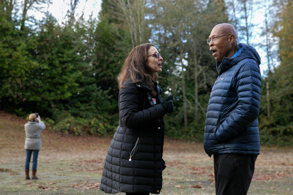 PAWS CEO Heidi Wills chats with Sen. John Lovick after the watch the release of a red-tailed hawk Wednesday, Nov. 23, 2022, at Evergreen Cemetery in Everett, Washington. (Ryan Berry / The Herald)

