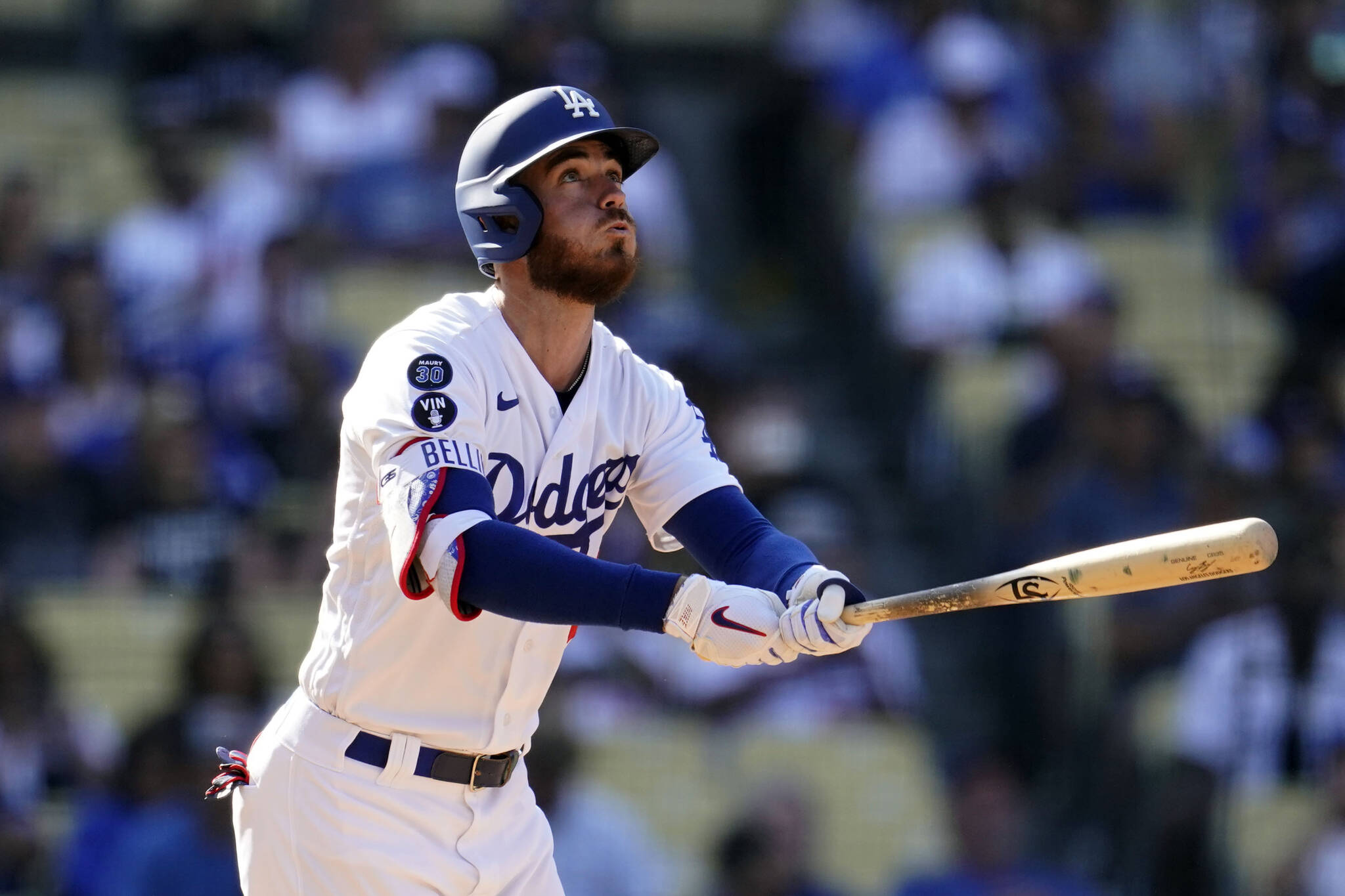 The Dodgers’ Cody Bellinger watches his solo home run during the seventh inning of a game against the Rockies on Oct. 5 in Los Angeles. (AP Photo/Marcio Jose Sanchez)