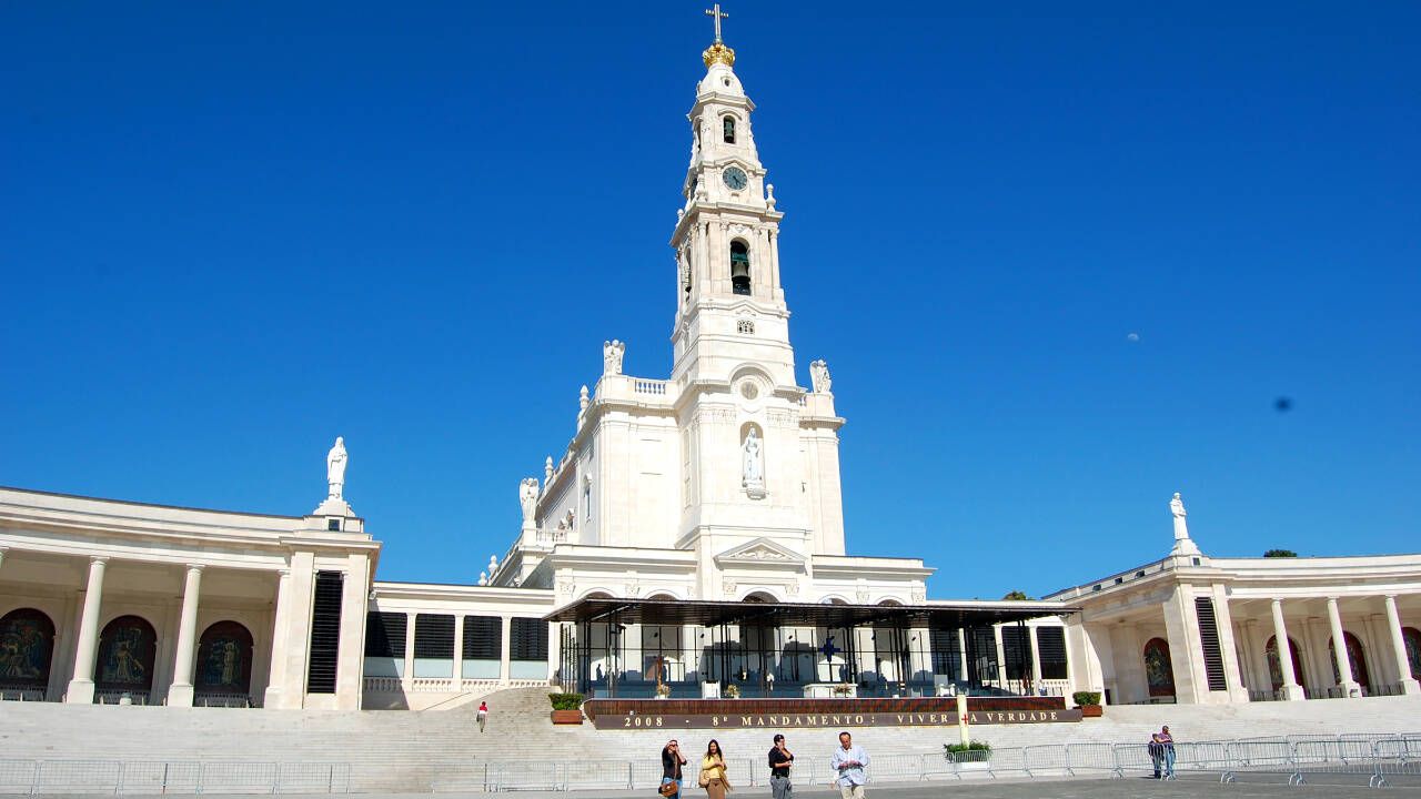 The towering Basilica of Our Lady of Fatima sits at the head of a vast esplanade. At the top of the steps, a covered open-air altar, cathedra (bishop’s chair) and pulpit stand ready to conduct Mass to the thousands of pilgrims who come to celebrate the Virgin of Fatima on the 13th day of each month from May through October.