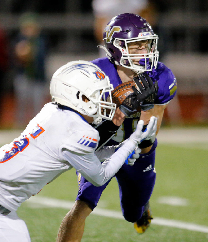 Lake Stevens safety David Brown snags a game-sealing interception in the fourth quarter. (Ryan Berry / The Herald)
