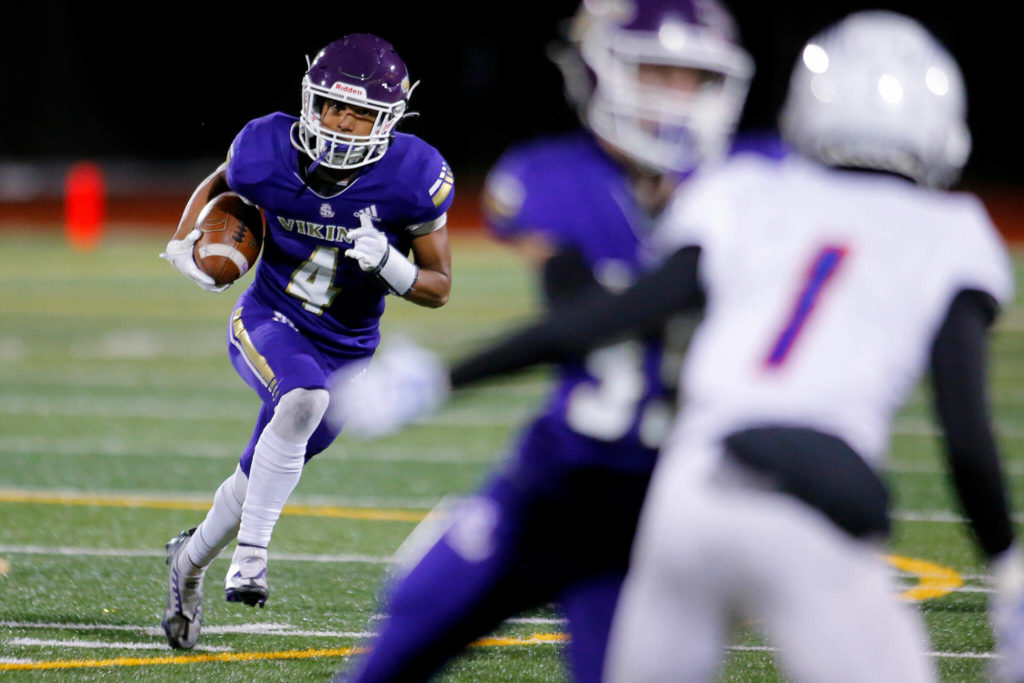 Lake Stevens’ Cassidy Bolong-Banks runs in the open field during the 4A semifinal against Graham-Kapowsin on Saturday, Nov. 26, 2022, at Lake Stevens High School in Lake Stevens, Washington. (Ryan Berry / The Herald)
