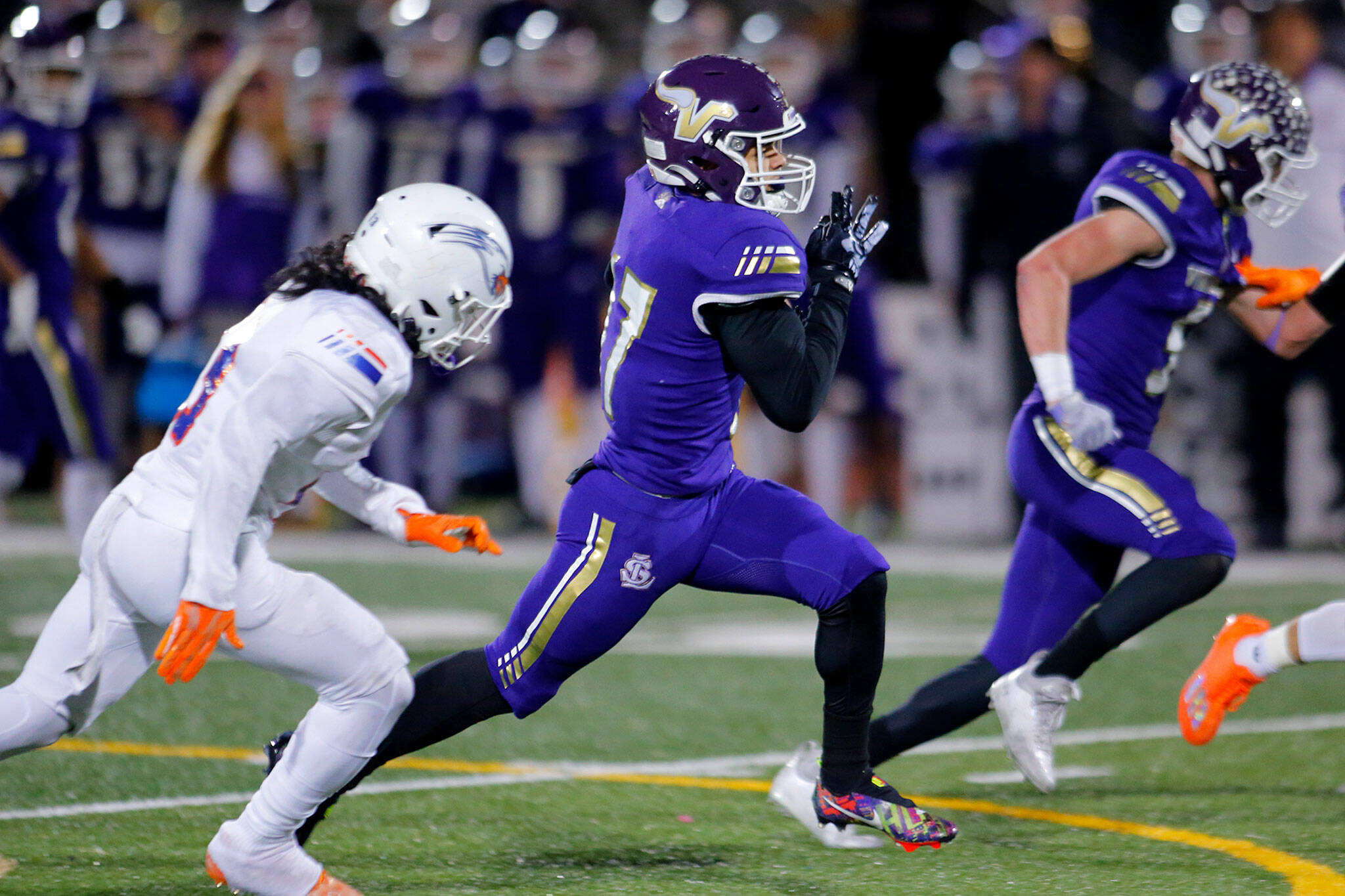 Lake Stevens star running back Jayden Limar races for a 55-yard touchdown run during the Vikings’ 42-28 win over Graham-Kapowsin in a Class 4A state semifinal Saturday evening. (Ryan Berry / The Herald)