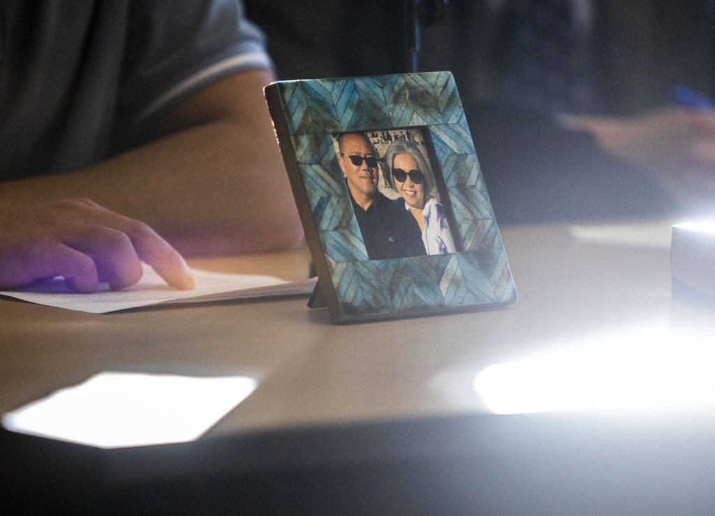 A framed photograph of Mila and Wilfrido Sarmiento is displayed during their grandson’s reading of his victim impact statement to the court during Caleb Wride’s sentencing on Monday, Nov. 28, 2022 in Everett, Washington. (Olivia Vanni / The Herald)
