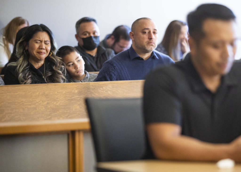Family members of Mila and Wilfrido Sarmiento become emotional during Caleb Wride’s sentencing on Monday, Nov. 28, 2022 in Everett, Washington. (Olivia Vanni / The Herald)

