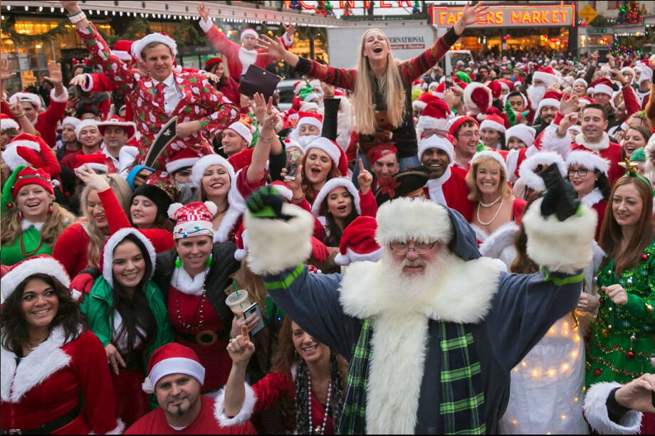 Christmas in Seattle comes with activities for all ages, from festive lights for kids to the silly, boozy Seattle SantaCon. Seattle SantaCon photo