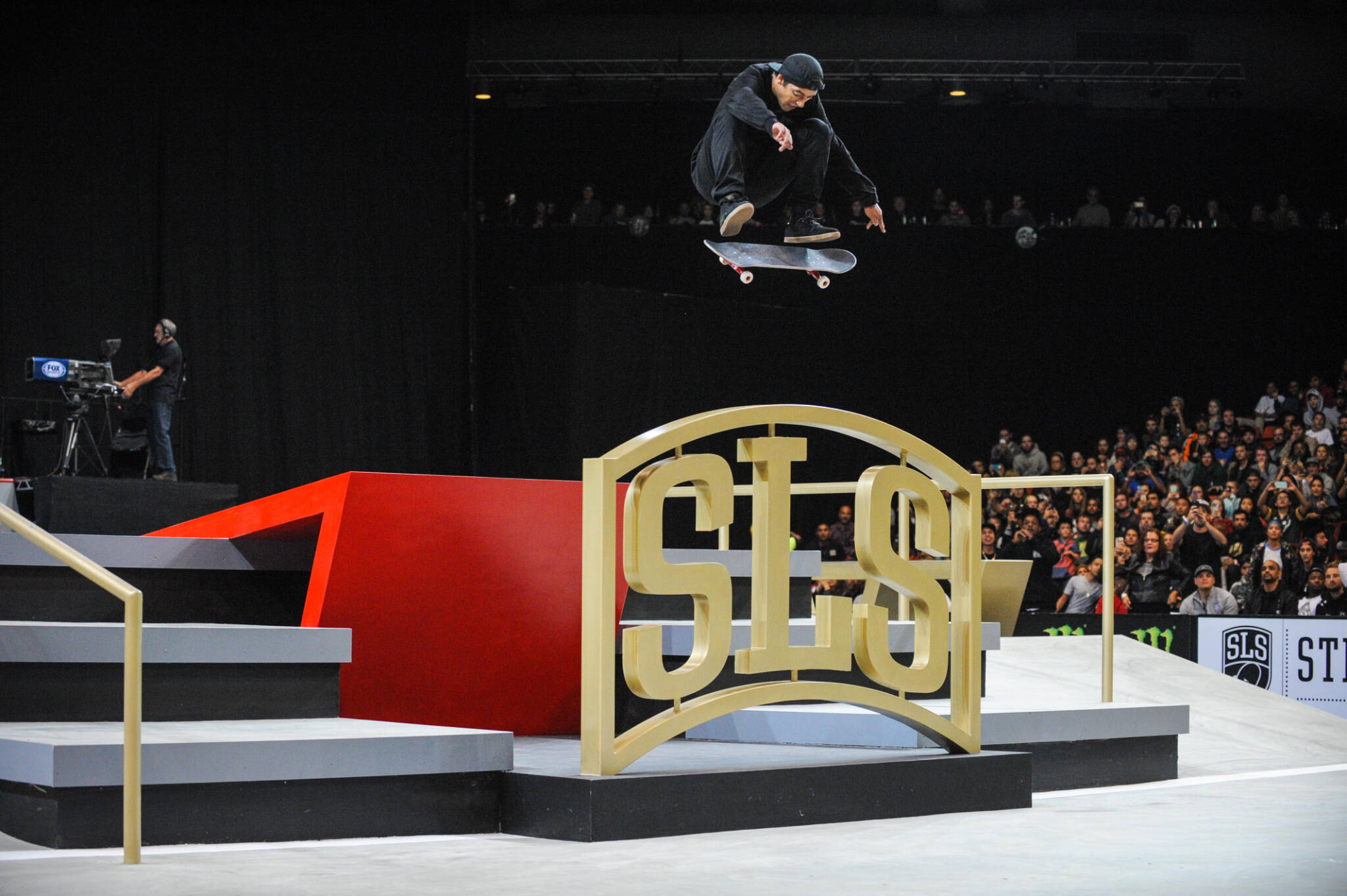 Brazilian skater Kelvin Hoefler jumps over the SLS sign during a Street League Skateboarding event. (Photo provided by SLS)
