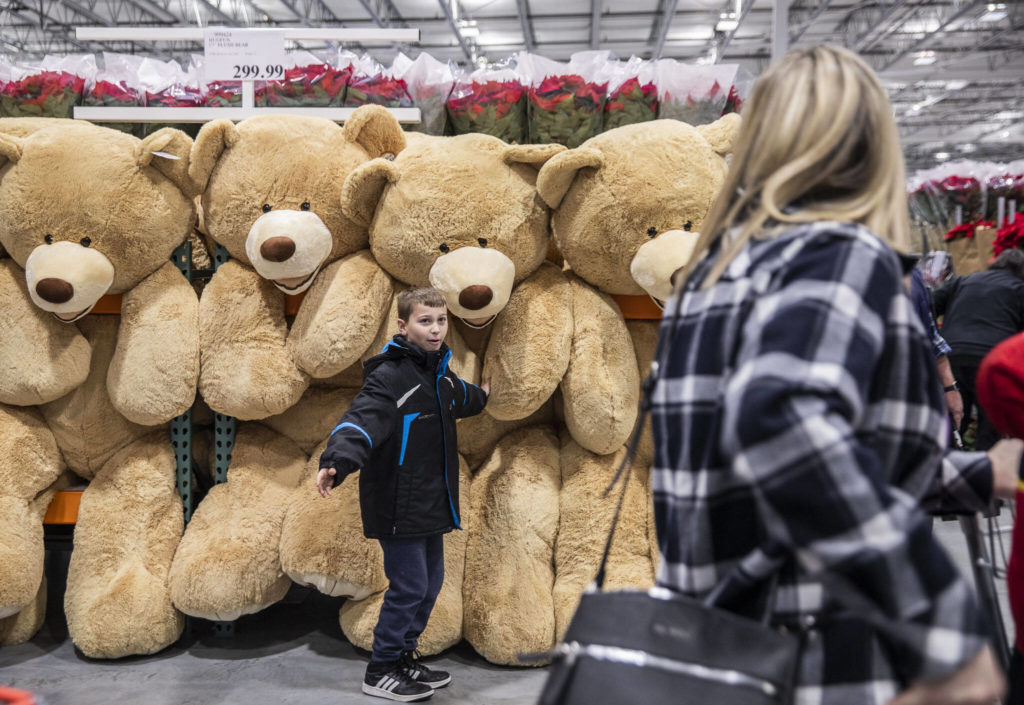 Gage Hestand, 10, tries to convince his mom to buy a large teddy bear at the new Costco in Lake Stevens on Friday. (Olivia Vanni / The Herald)
