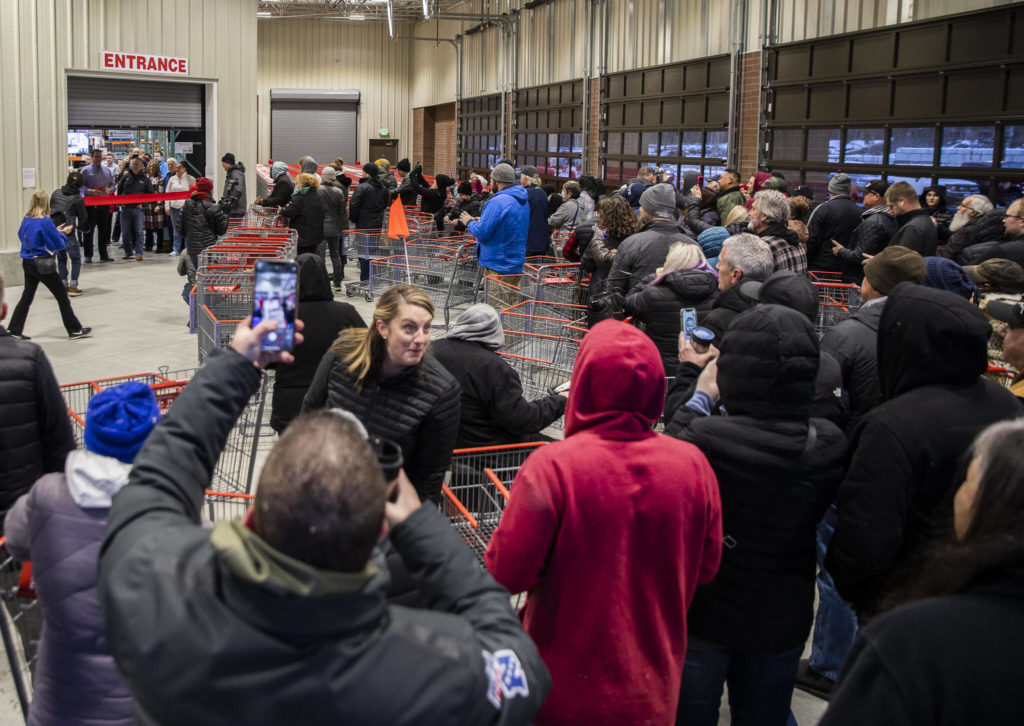 Costco shoppers wait in line to be the first inside the new store Friday in Lake Stevens. (Olivia Vanni / The Herald)
