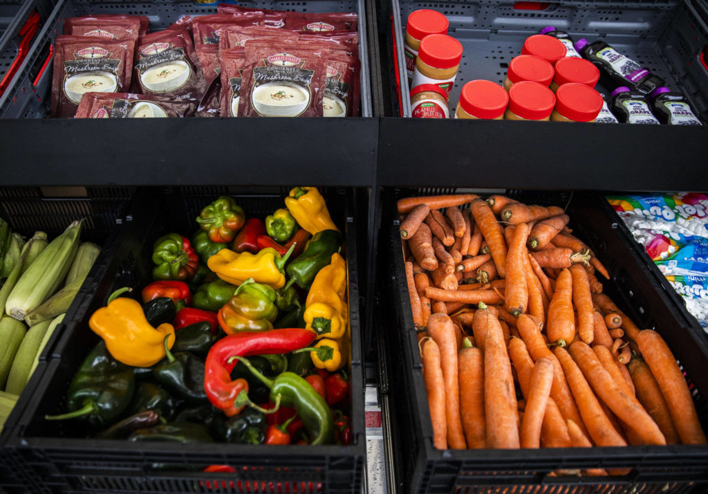 A selection of fresh produce and non-perishable foods available at the Mobile Market on Nov. 22, in Arlington. (Olivia Vanni / The Herald)
