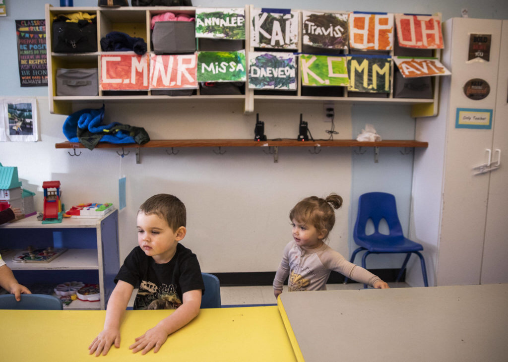 Riley, 7, and Harmony, 1, sit down for snack time at Tomorrow’s Hope Child Development Center in Everett. (Olivia Vanni / The Herald)
