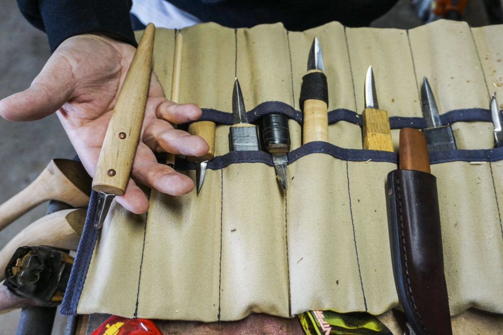 Ty Juvinel displays some of his work working tools on Wednesday, Dec. 1, 2022 in Tulalip, Washington. (Kayla Dunn / The Herald)
