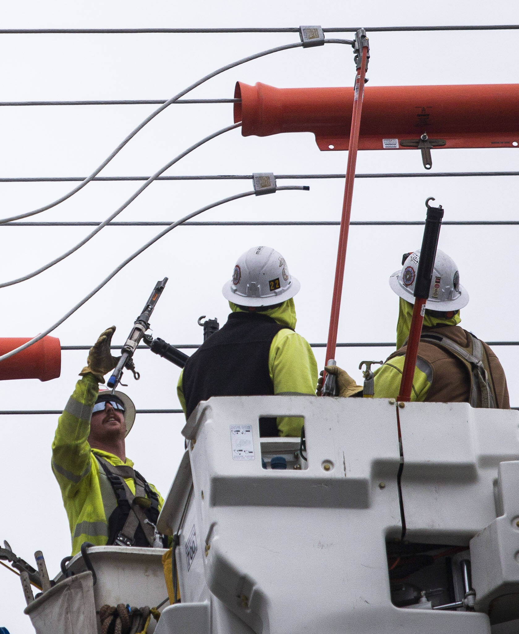Snohomish County PUD workers install new transformers along 132nd Street Oct. 25 in Mill Creek. (Olivia Vanni / The Herald)