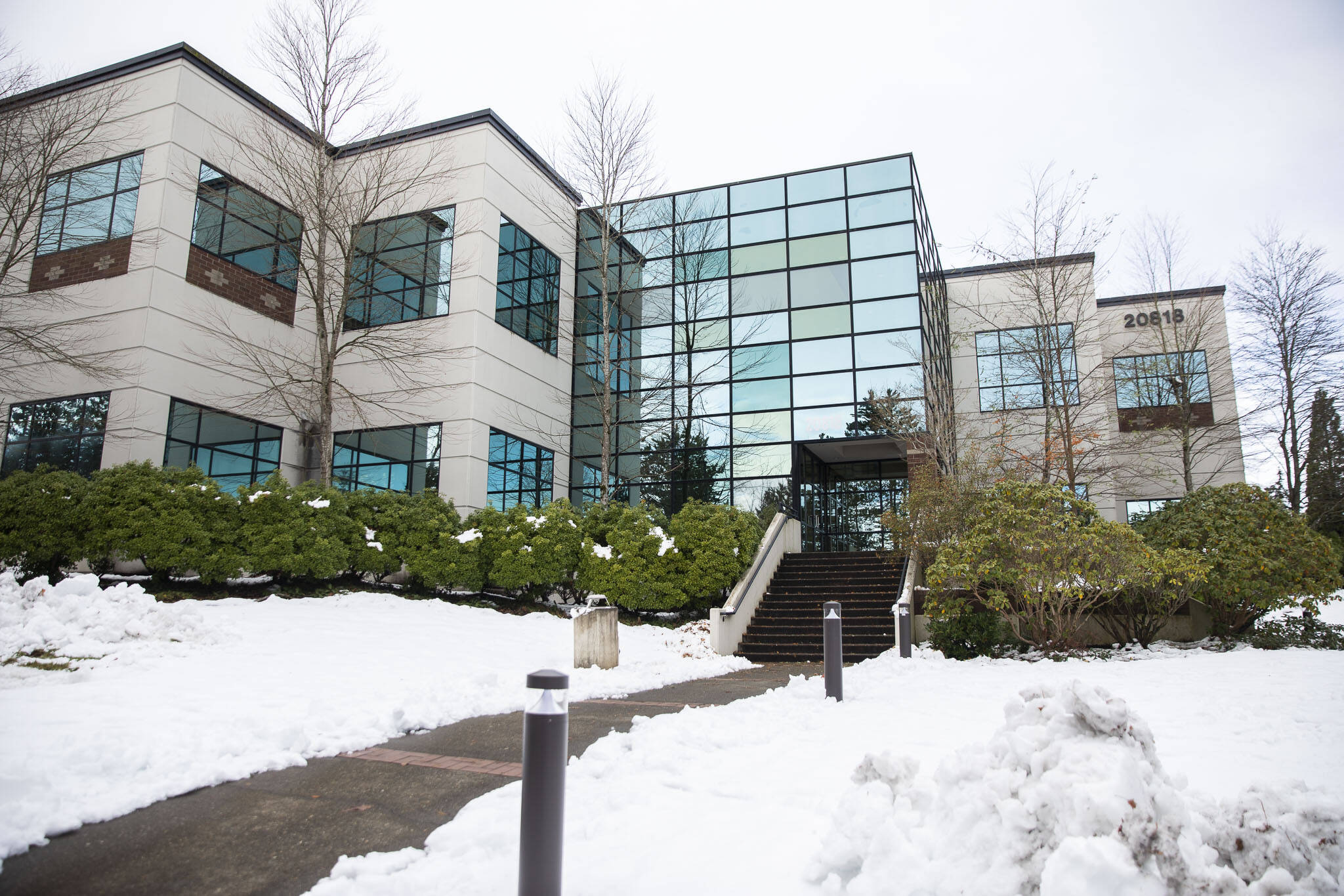 Snow lingered outside the office building of Receivables Performance Management on Thursday, Dec. 1, 2022, in Lynnwood, Washington. (Olivia Vanni / The Herald)