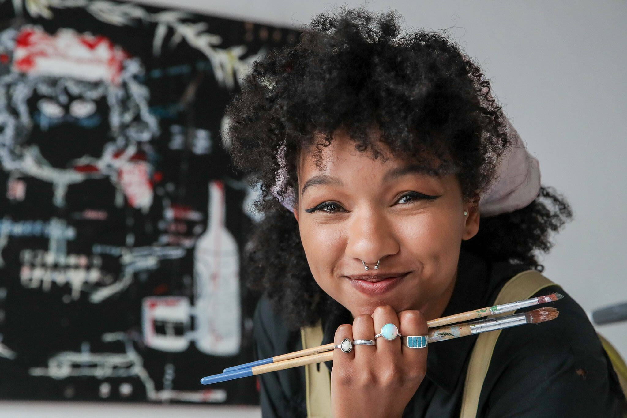 Photos by Kevin Clark / The Herald
Mahllie Beck, 24, specializes in mixed-media, murals, printmaking and upcycled, or recycled, art.
Mahllie Beck is a mixed media artist specializing in acrylic painting and interior murals. (Kevin Clark / The Herald)