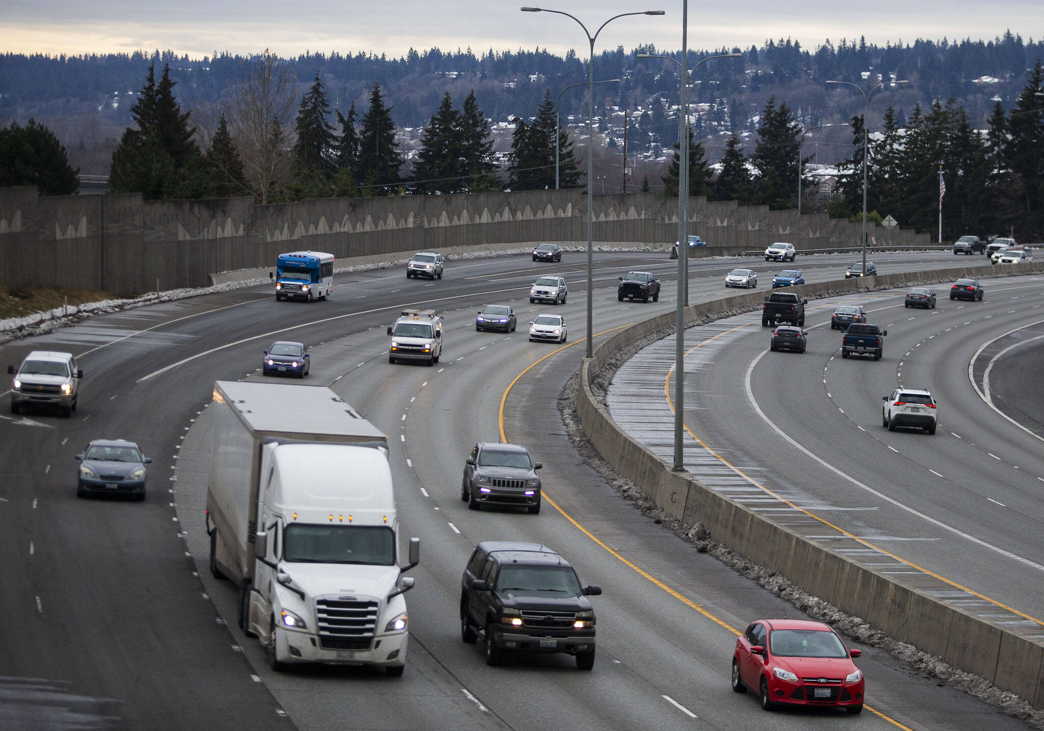 Traffic moves northbound on Interstate 5 through Everett on Friday. Some parts of I-5 North before 41st Street remain bumpy after work to replace concrete panels since October. (Olivia Vanni / The Herald)