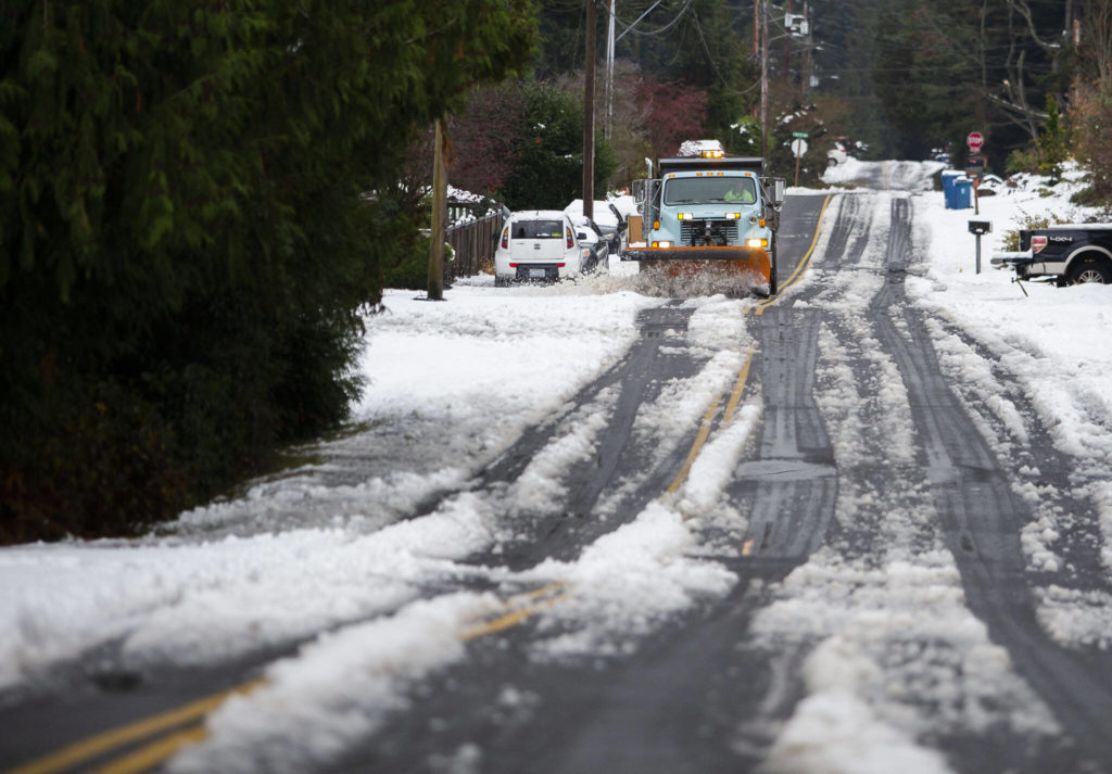 A snow plow clears snow off of 92nd Avenue West on Wednesday, Nov. 30, 2022, in Edmonds, Washington. (Olivia Vanni / The Herald)
