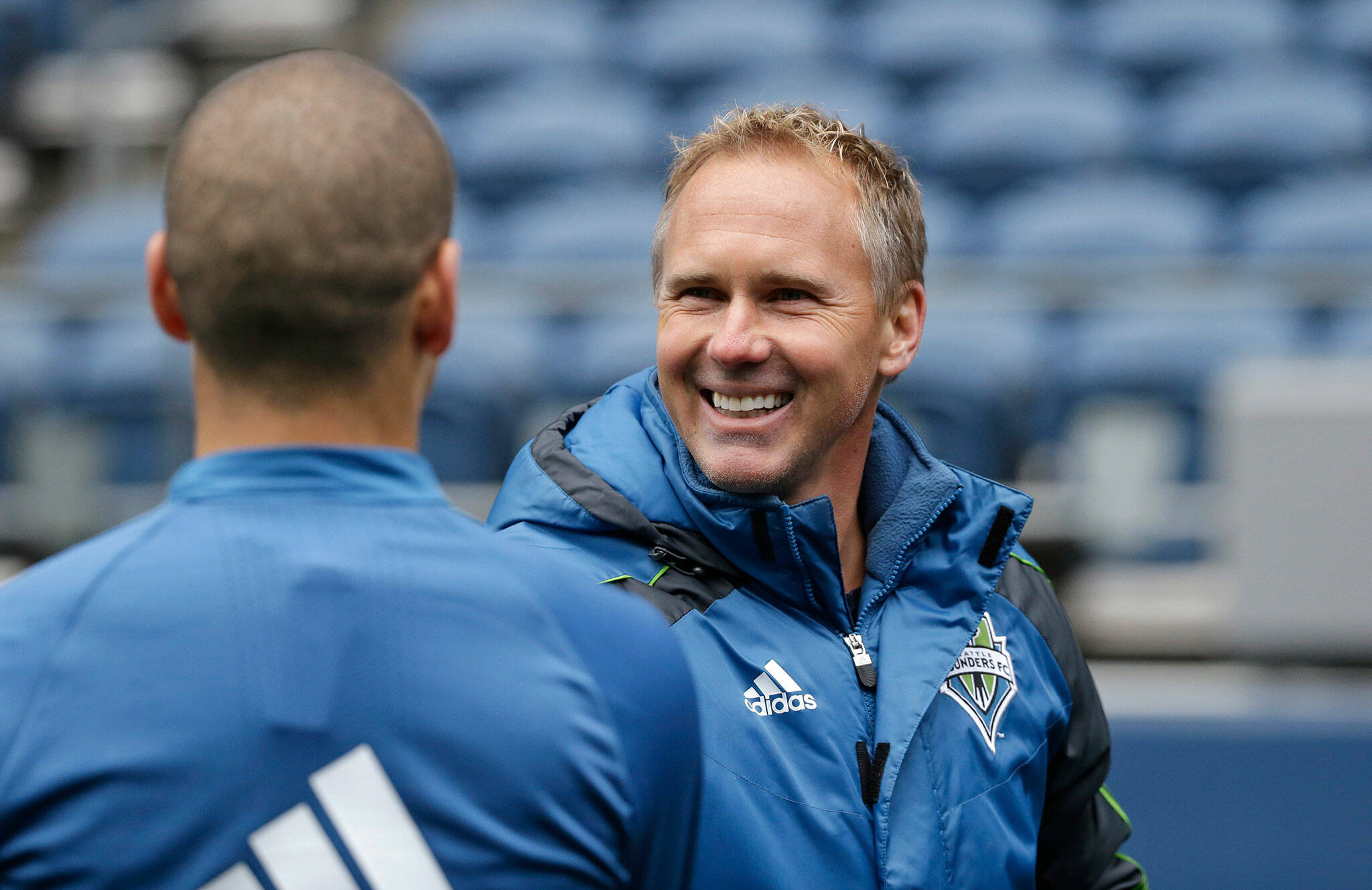 Fromer Seattle Sounders sporting director Chris Henderson, a Cascade High School alum, greets a player after a soccer training session Feb. 22, 2016, in Seattle. Henderson is now the sporting director of Inter Miami. (AP Photo/Elaine Thompson)