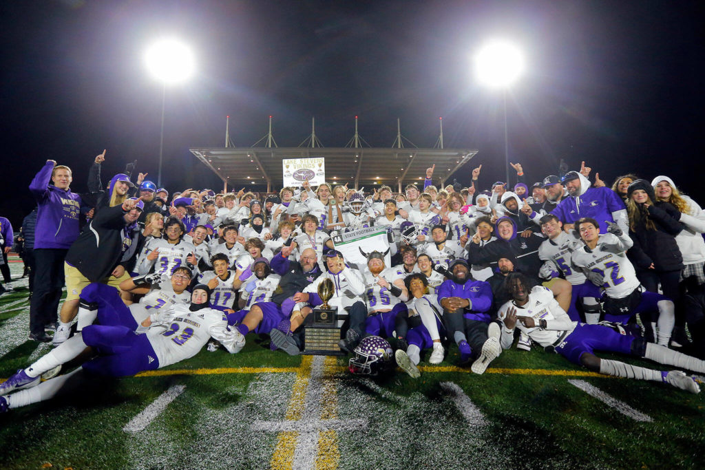 The 2022 Lake Stevens Vikings celebrate their championship victory over Kennedy Catholic in the WIAA 4A State Football Championship game Saturday, Dec. 3, 2022, at Mount Tahoma Stadium in Tacoma, Washington. (Ryan Berry / The Herald)
