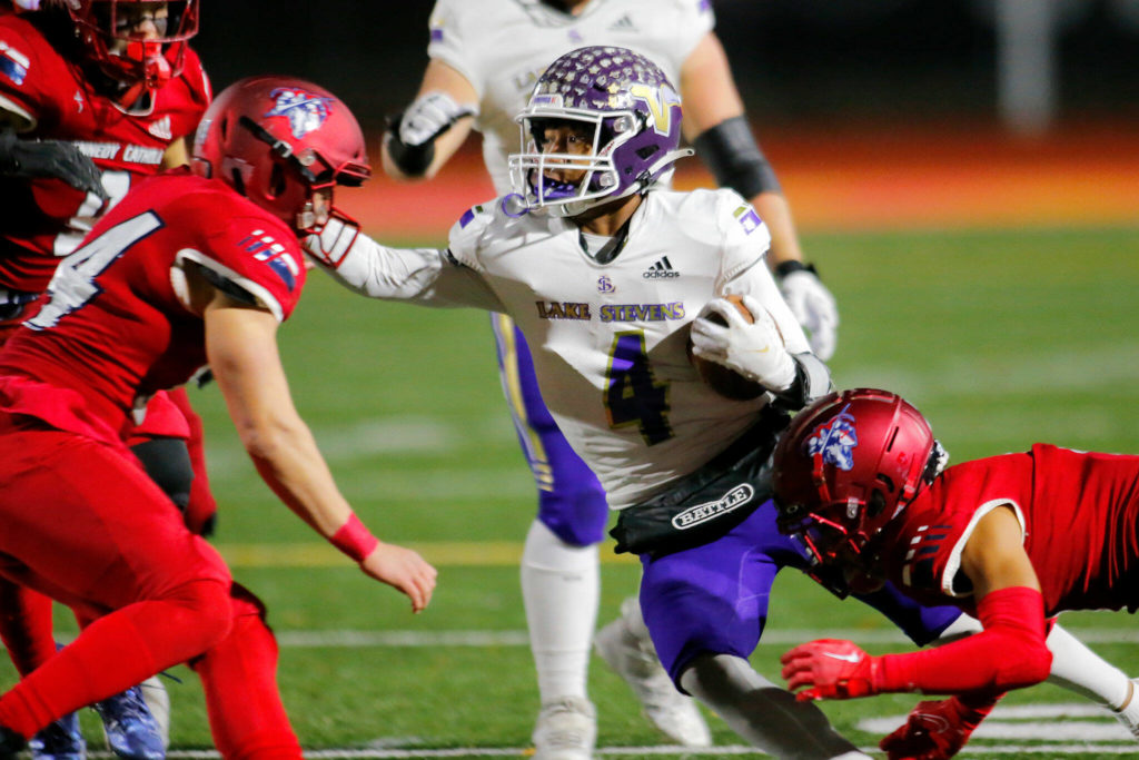 Lake Stevens’ Cassidy Bolong-Banks gets taken down after a catch against Kennedy Catholic in the WIAA 4A State Football Championship game Saturday, Dec. 3, 2022, at Mount Tahoma Stadium in Tacoma, Washington. (Ryan Berry / The Herald)
