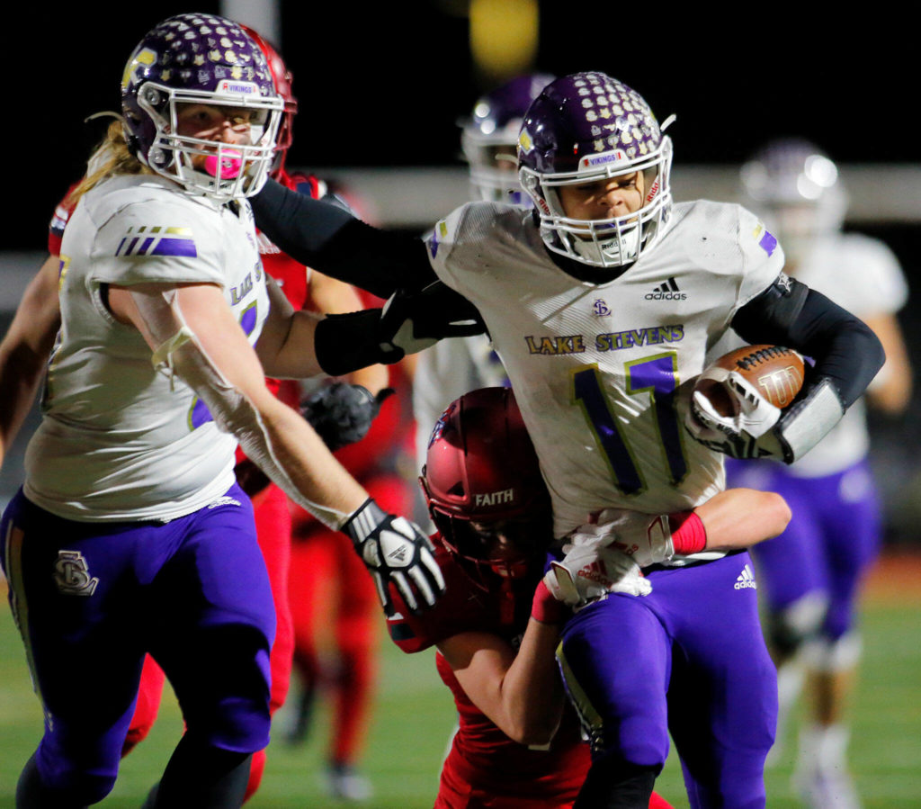 Lake Stevens’ Jayden Limar breaks a long run against Kennedy Catholic in the WIAA 4A State Football Championship game Saturday, Dec. 3, 2022, at Mount Tahoma Stadium in Tacoma, Washington. (Ryan Berry / The Herald)
